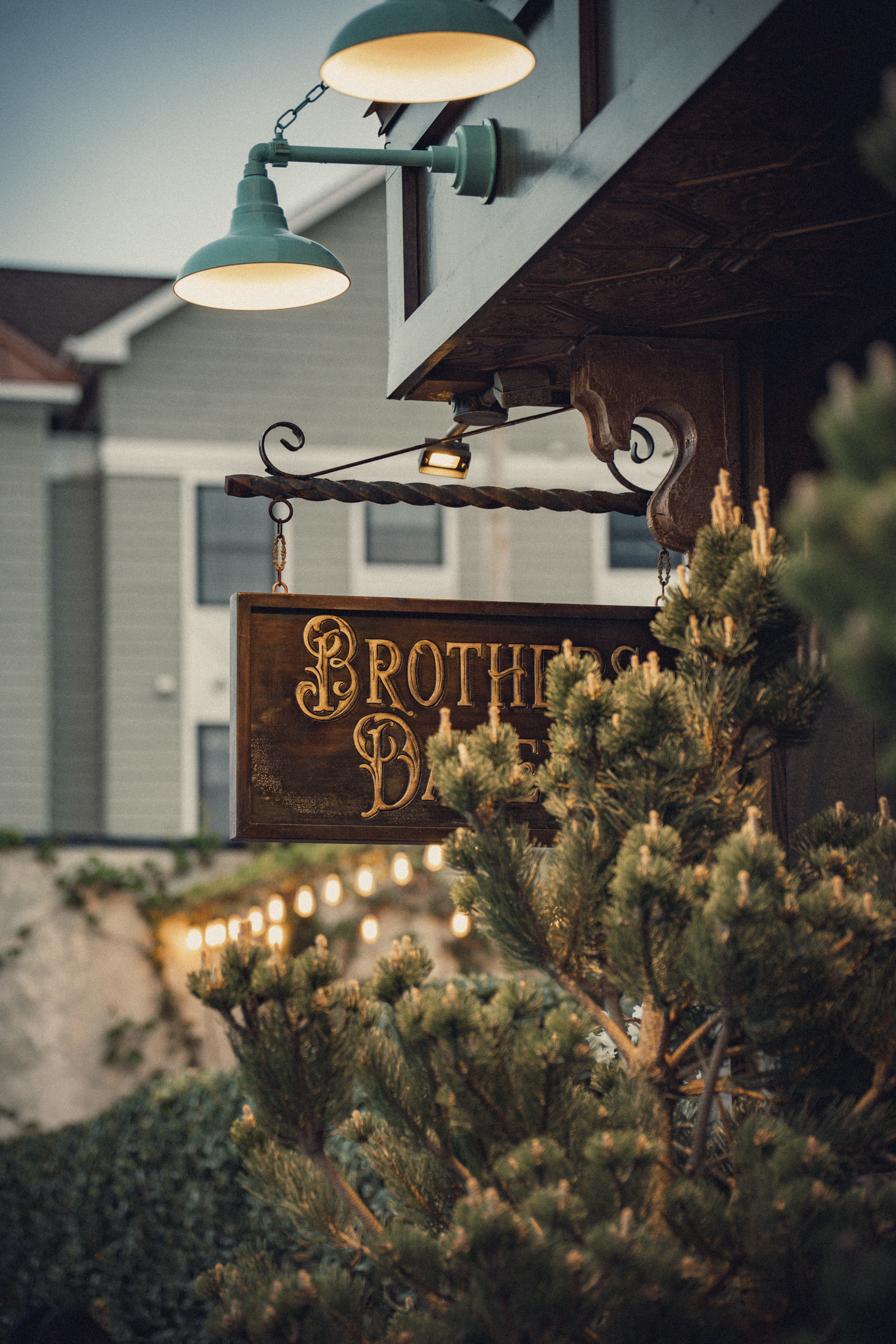 Brothers Daley signage at dusk