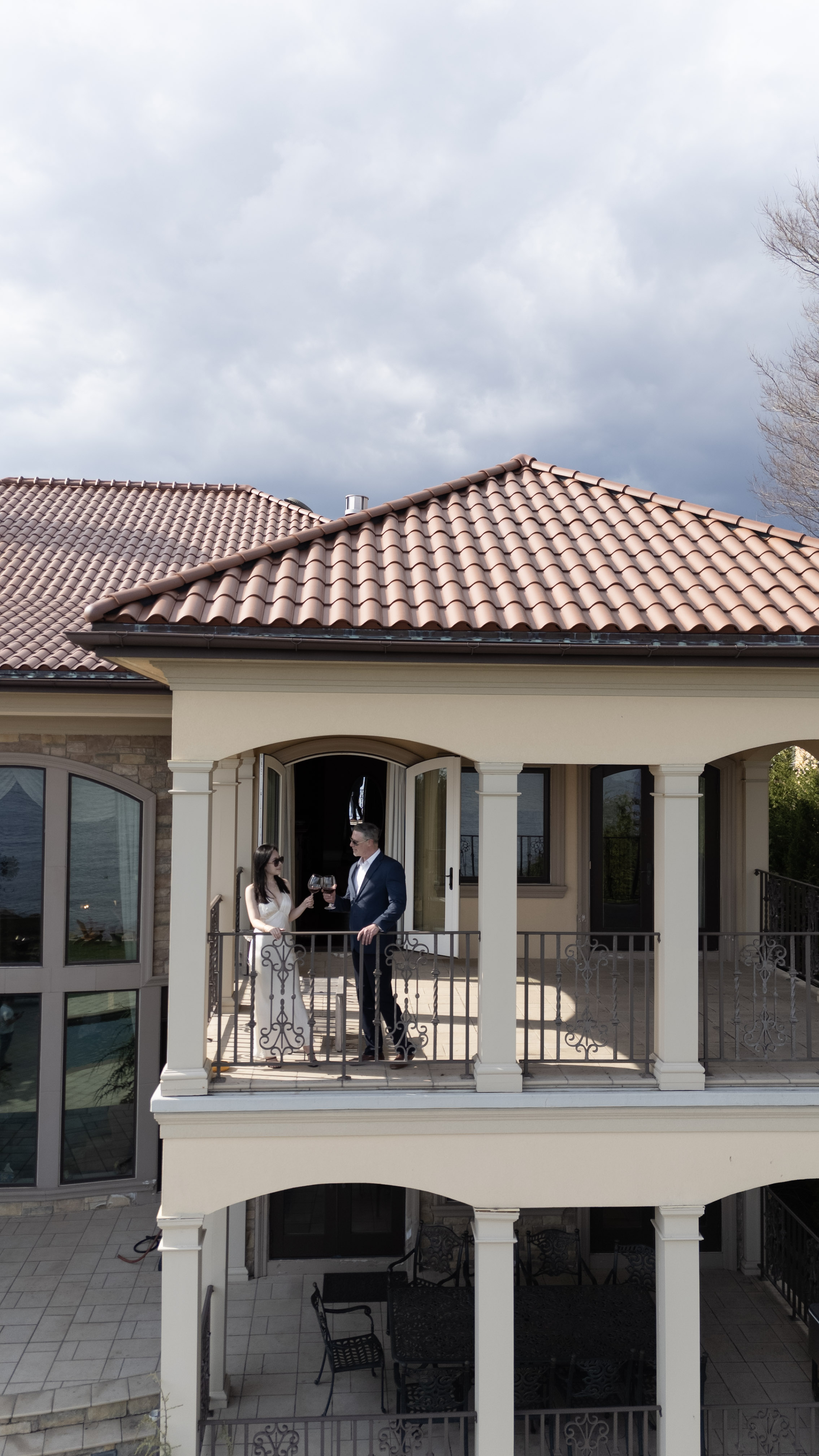 Couple on the balcony of a luxury estate